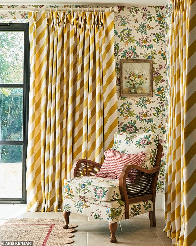 Breathe new life into an old armchair with an eye-catching fabric, teaming it with stripes and statement plants. Armchair in Woodland Floral fabric, £69 per m; Woodland Floral wallpaper, £89 per roll; curtains in Paper Straw Stripe fabric, £79 per m, all Harlequin x Sophie Robinson, harlequin.sanderson designgroup.com
